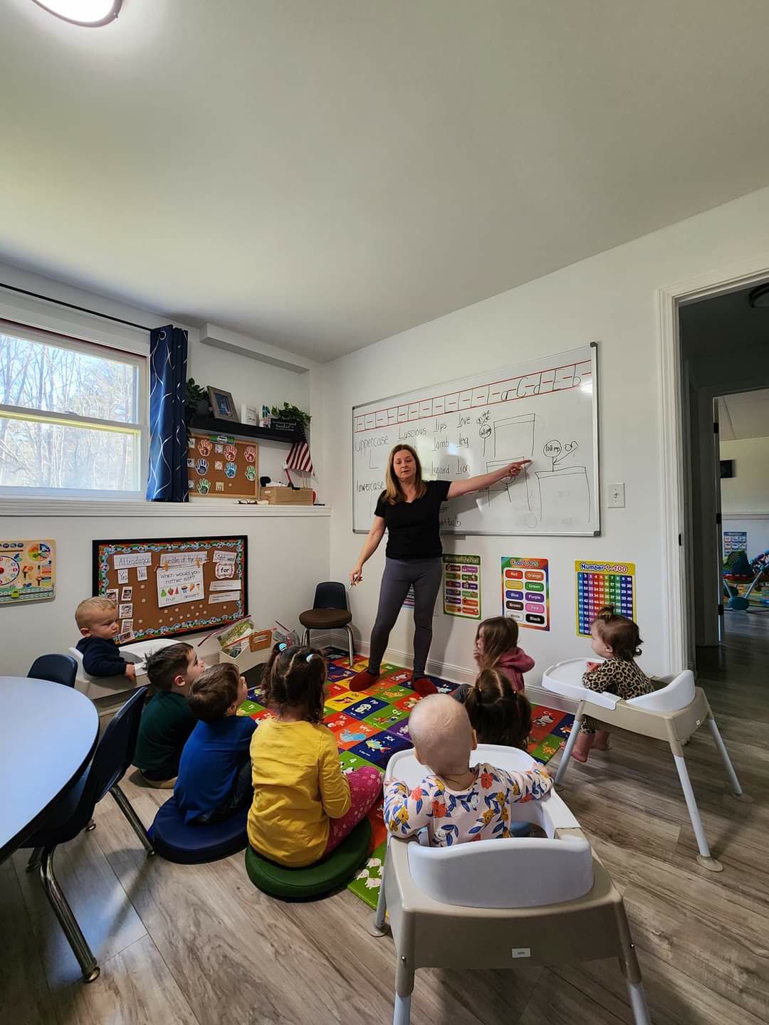 Renee leading a hands-on learning activity with the children in her home daycare